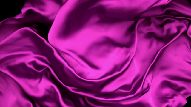 粉色丝质织物在超慢的动作中横向流动和摆动，近距离，黑色背景视频素材