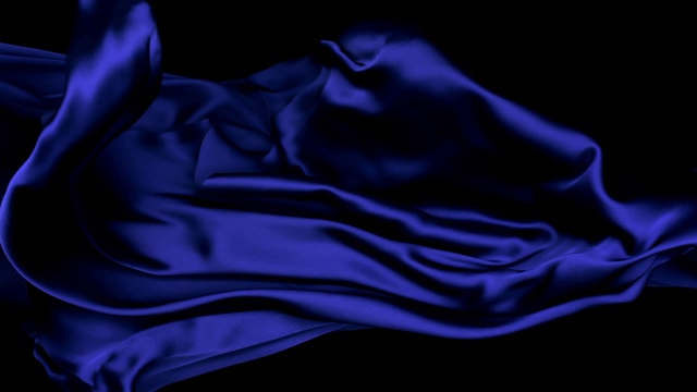 金属色的深蓝色丝质织物在超慢的动作中横向流动和摆动，近距离，黑色背景视频下载