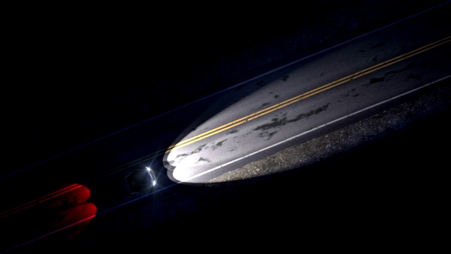 无人机视图的汽车驾驶在一个夜晚的乡村道路与前灯，无缝循环视频下载