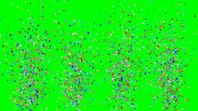 蓝色、红色和白色的节日五彩纸屑在绿色背景上爆炸落下。慢动作视频下载
