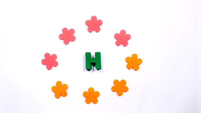 绿动，舞英文字母H。白色背景上跳舞的字母。视频下载