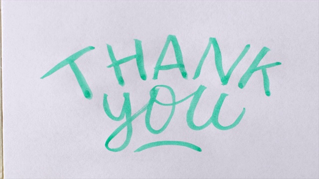 用绿色墨水写出“谢谢你”视频素材