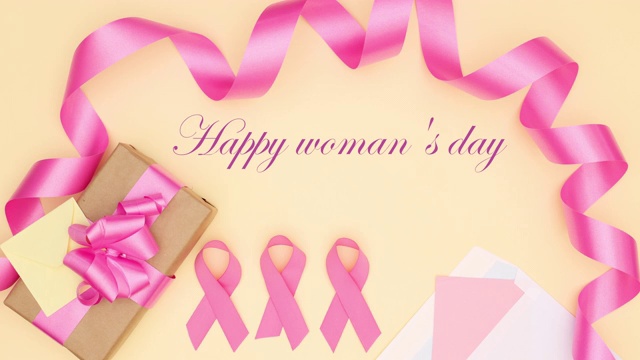 国际妇女节的标题出现粉色丝带和礼物-停止运动视频下载