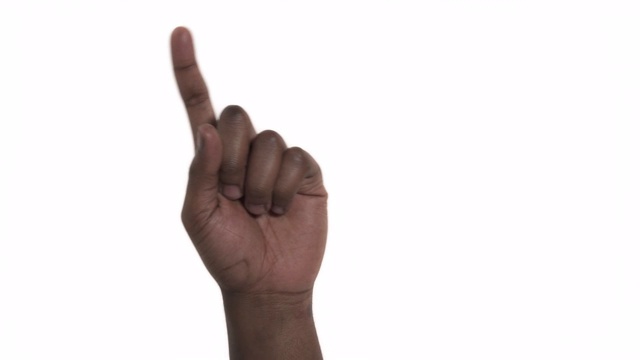 一个人用食指指着虚拟物体的特写。手势和身体语言的概念视频素材