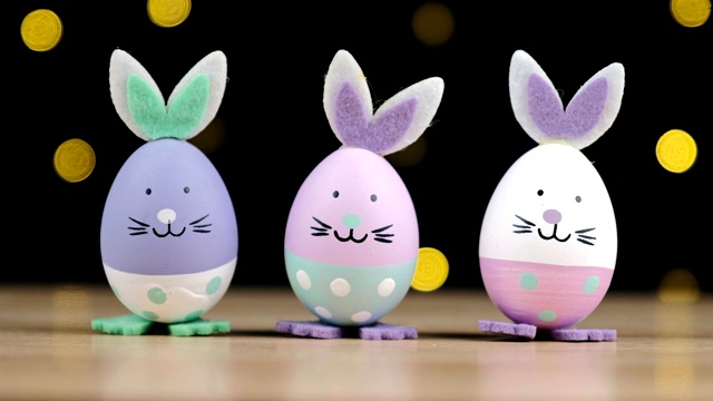 可爱的复活节兔子装饰在黑色背景与led灯散keh，复活节快乐的概念。视频素材