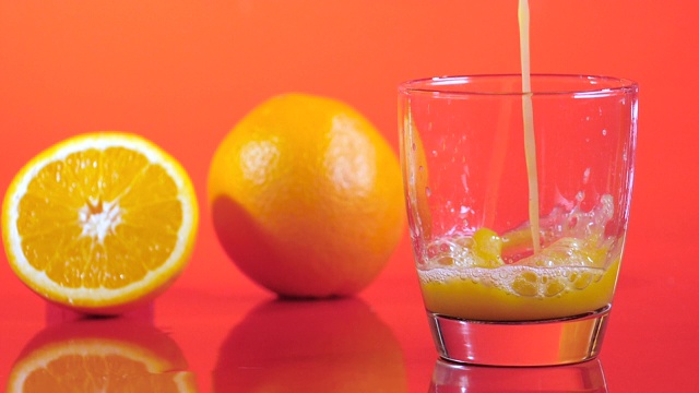 橙汁飞溅，慢动作视频素材
