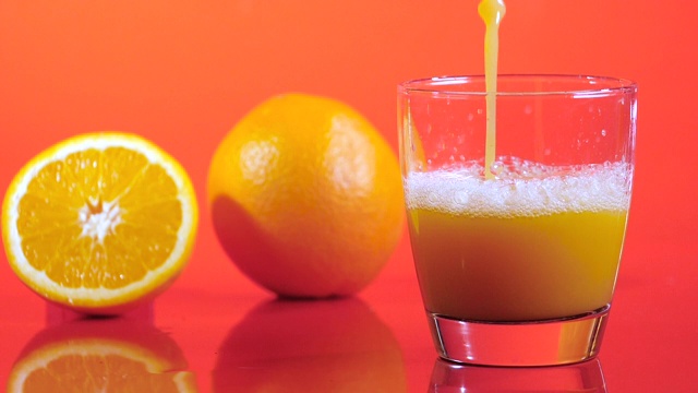 橙汁飞溅，慢动作视频素材