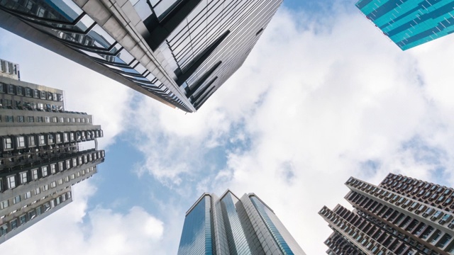 时间推移:垂直的高层摩天大楼在香港的城市景观视频素材