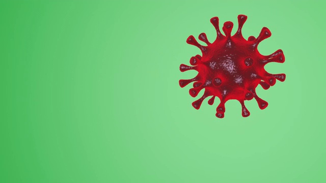 红色病毒在绿色背景下移动的动画视频- Covid-19冠状病毒概念- 3D渲染视频下载