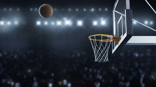 在闪光灯的背景下，篮球打在了篮筐上视频下载