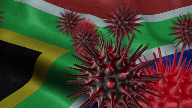 在飘扬的南非国旗上传播冠状病毒疾病视频下载