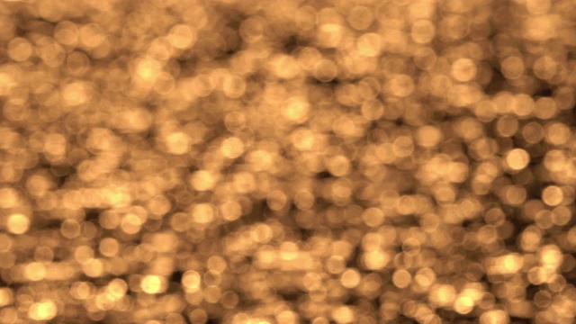 抽象模糊闪烁的金色背景的水波表面在日落视频下载