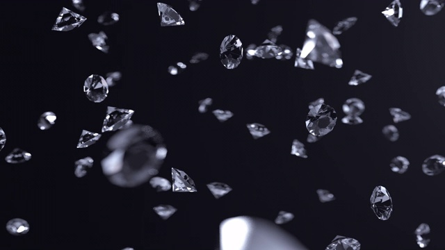 在黑色背景上的钻石下落的慢动作抽象动画。3 d动画。4 k。视频下载