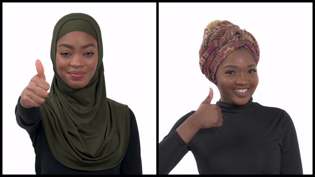 两个美丽微笑的非洲妇女戴着传统的头饰(希贾布)展示积极的姿态的特写。竖起大拇指。垂直拼贴视频下载