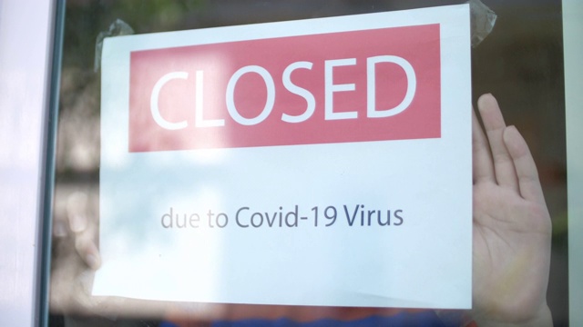 因Covid-19病毒大流行关闭店铺标志4K视频素材