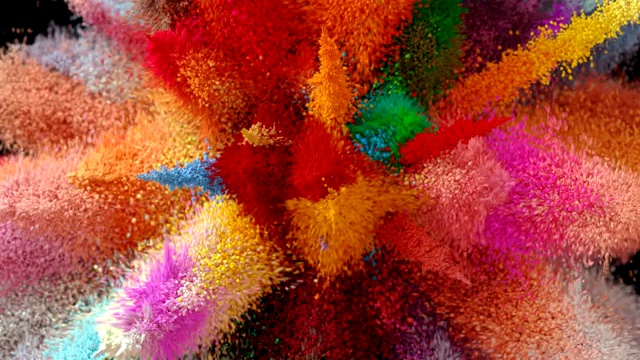 美丽的爆炸彩色粒子在一个黑色的背景视频下载
