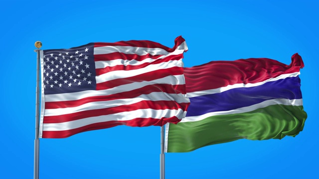 冈比亚和美国的国旗一起在深蓝色的天空中飘扬。高清3D渲染。视频下载