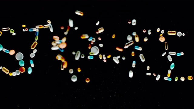 SLO MO LD“中风”碑文由五颜六色的药片、药丸和胶囊飞向空中视频素材
