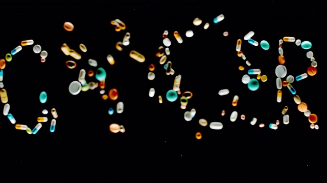 SLO MO LD“癌症”碑文由五颜六色的药片、胶囊和胶囊飞向空中视频素材