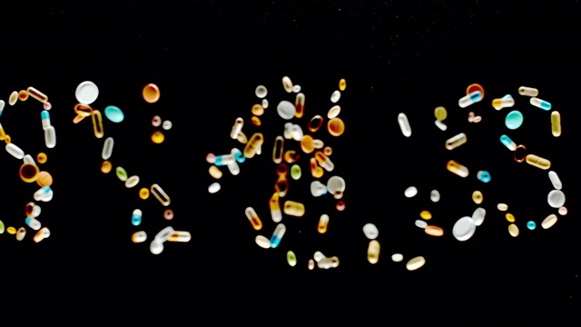 SLO MO LD“病”碑文由五颜六色的药片、药片和胶囊飞向空中视频素材