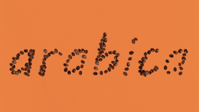 单词阿拉比卡形状的咖啡豆在橙色的背景视频下载