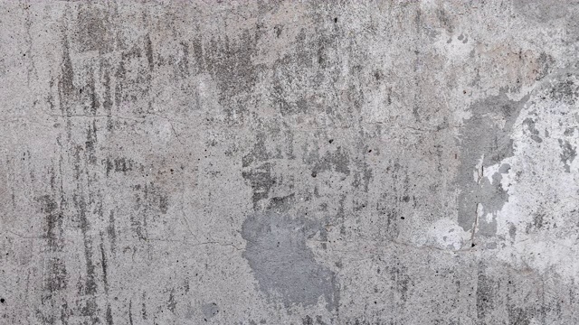 纹理背景的旧灰色混凝土墙斑点，污迹，油漆痕迹，划痕和粗糙。伸缩镜头运动视频下载