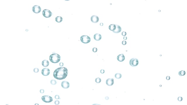 慢动作和近距离的微小气泡流动下的一个白色的背景视频素材