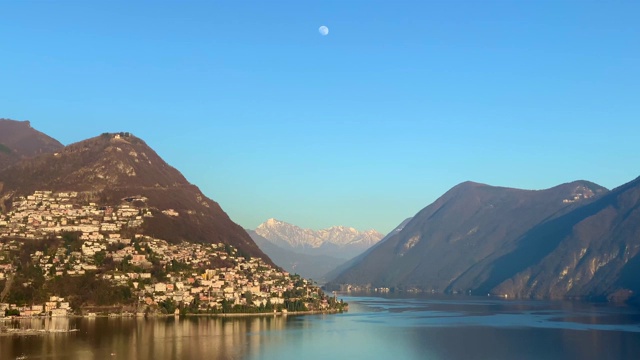 俯瞰城市和高山卢加诺湖与山和瑞士的月亮视频素材