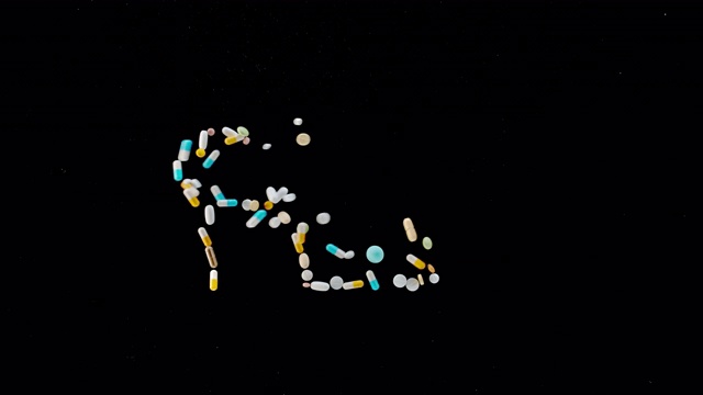 SLO MO LD“FLU”题字由五颜六色的药片、药片和胶囊飞离表面视频下载