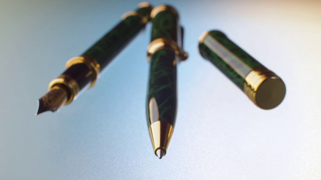 圆珠笔和钢笔在玻璃桌子上视频下载