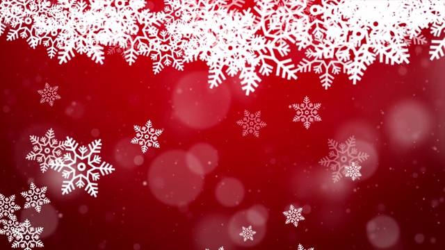雪花飘落在蓝色的天空与红色颗粒在冬季圣诞循环背景视频素材