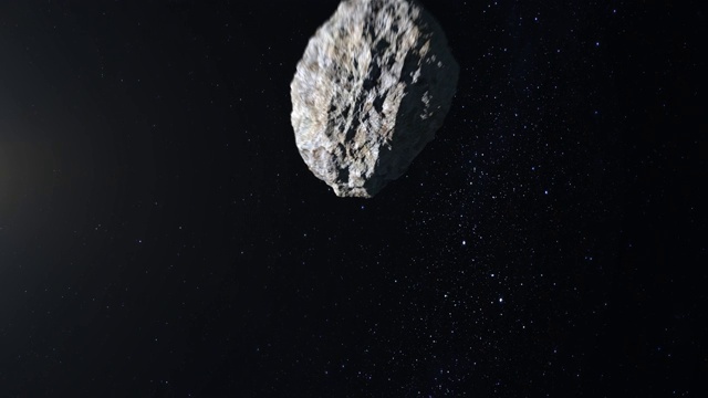小行星在太空中飞行和旋转。小行星出现在屏幕上并迅速飞走。星空。4 k。星星闪烁。3 d渲染。视频素材