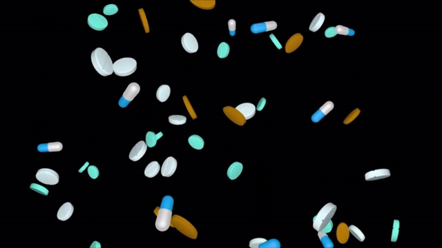 采购产品多色药丸，药片，药物下降循环动画背景视频下载
