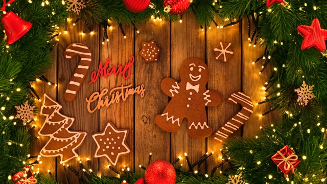 姜饼和圣诞装饰在木制的乡村桌子上视频素材