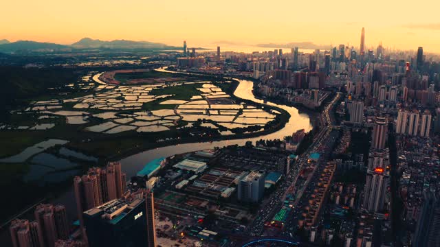 日落时分，深圳和香港交界处的无人机图像视频素材