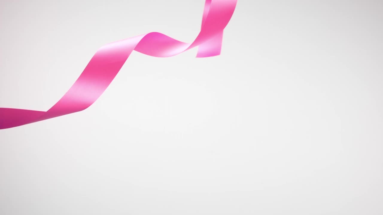 白色背景上的粉色丝带，为庆祝活动和派对的新年，生日派对，圣诞节或任何节日，在超级慢动作和关闭放弃和卷曲视频下载