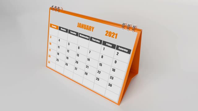 侧视图的飞行页日历2021年与橙色框架在白色的背景视频素材