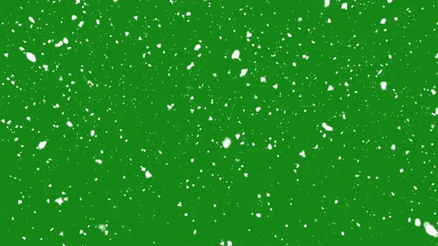 在绿色的屏幕上孤立的落下的雪视频素材