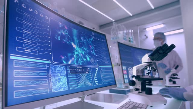 实验室设备，显微镜和计算机。屏幕上的DNA和脑电波研究。女性科学家的侧视图视频素材