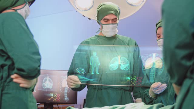 创新医疗技术理念，外科医生团队采用高科技的现代虚拟屏幕界面对手术室的呼吸系统进行诊断视频素材