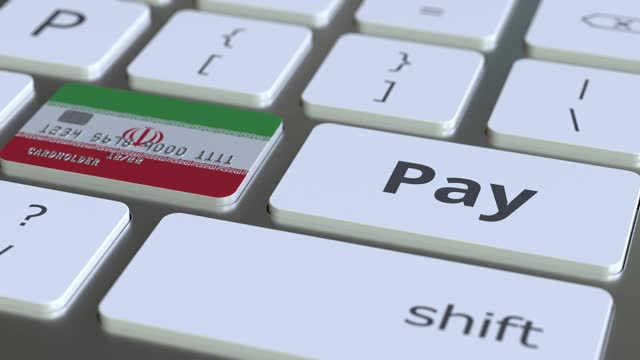 在键盘上用伊朗国旗作为键的银行卡视频素材