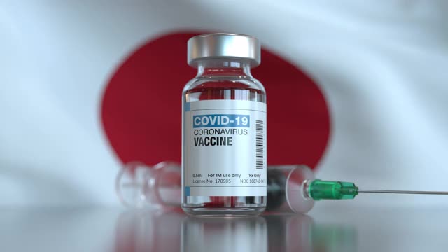 COVID-19疫苗和日本旗注射器，可循环使用视频素材