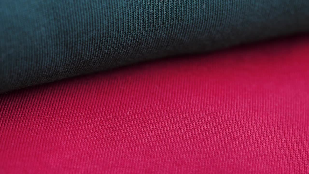 红色和绿色织物纹理材料纺织品宏模糊背景视频下载