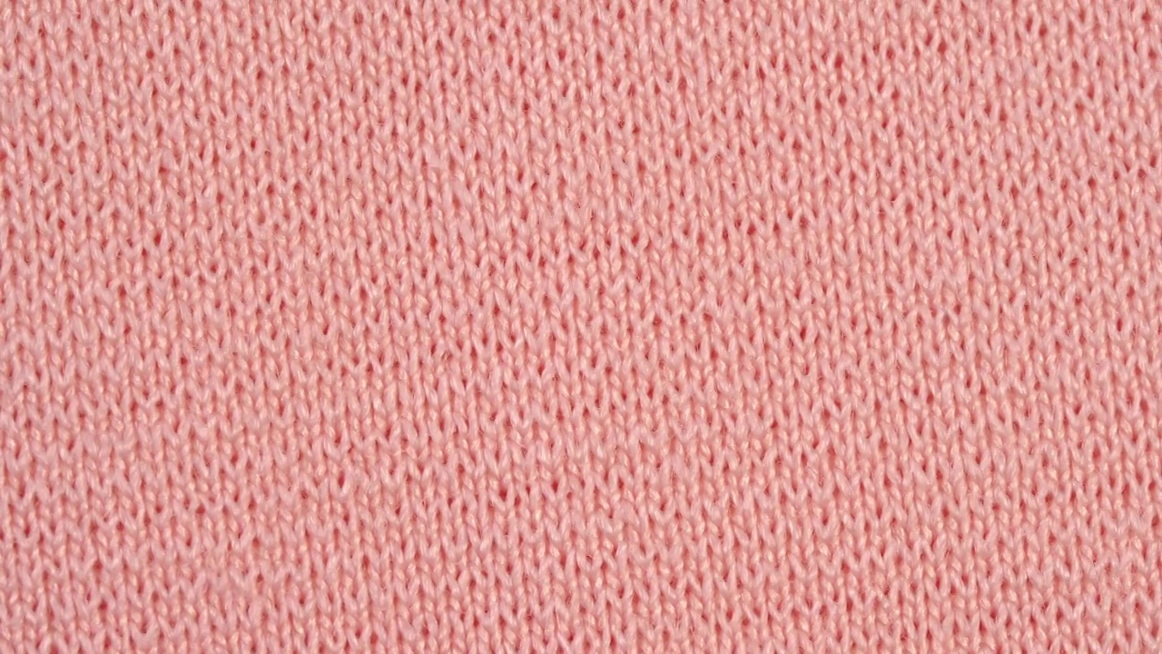 纺织品背景-粉红色尼龙弹力织物，有平纹结构。宏开枪。视频素材