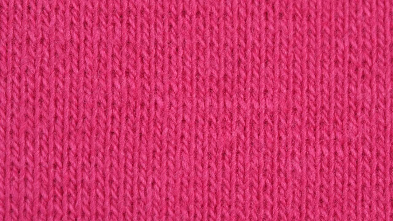 纺织背景-粉红色棉布弹力弹力织物。宏开枪。视频素材