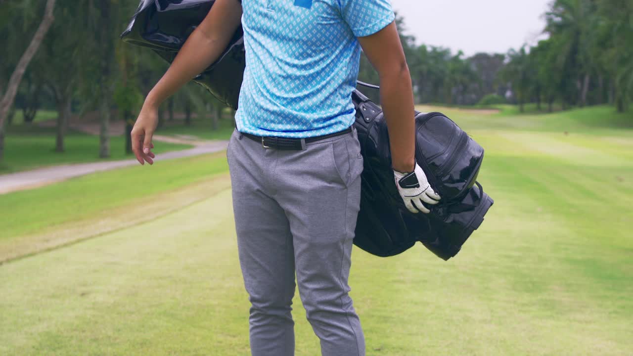职业高尔夫球场上的男性高尔夫球手。视频下载