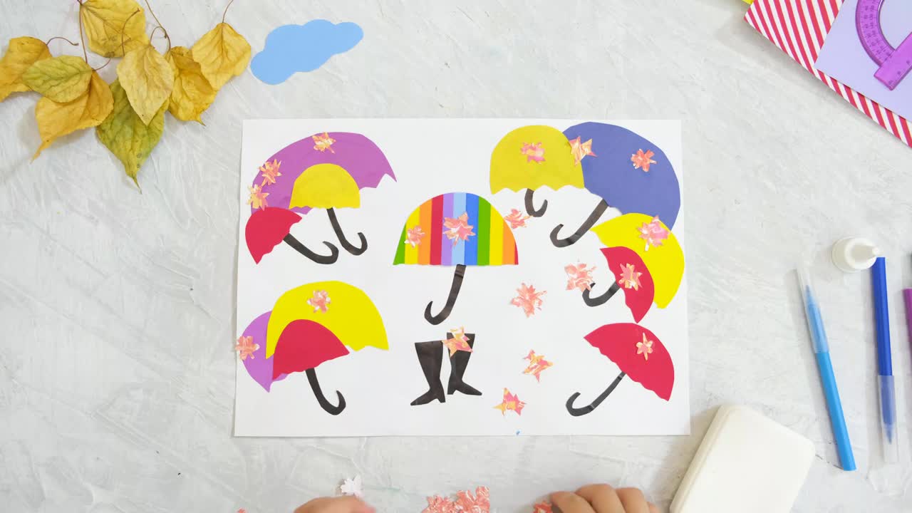 秋天的静物应用。儿童剪纸彩伞，儿童的工艺品。回到学校视频下载