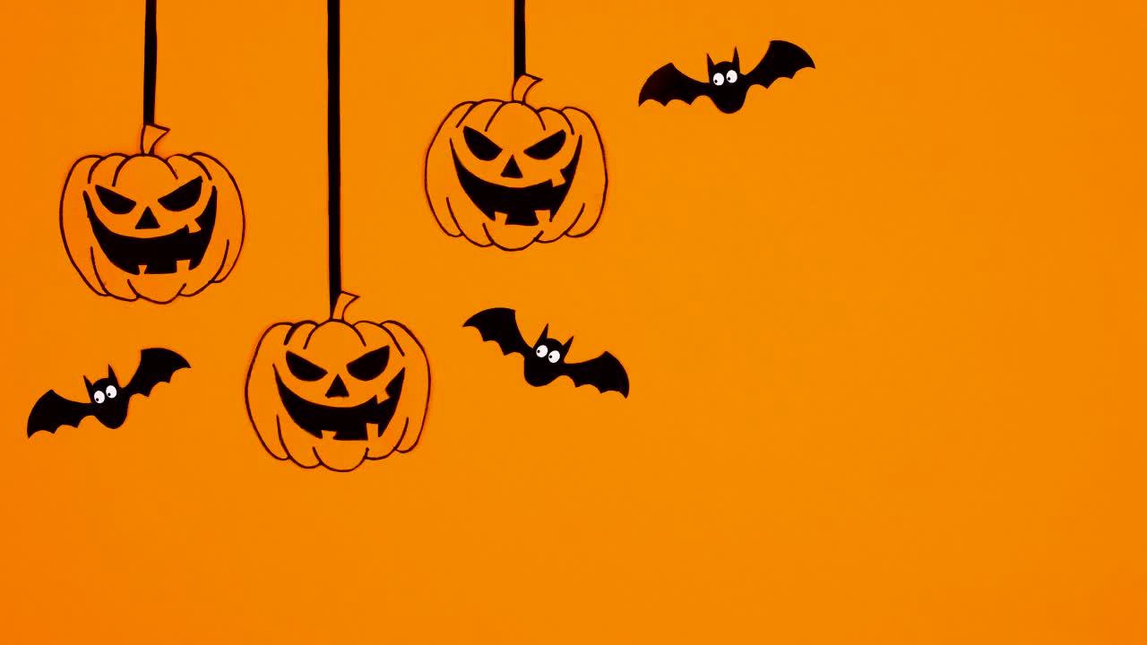 橙色主题的万圣节飞行蝙蝠和移动南瓜绳。停止运动视频素材