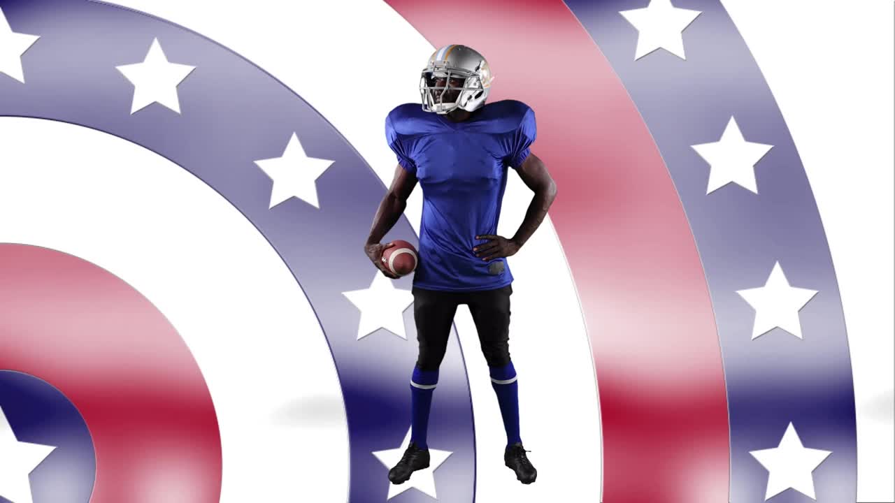 非裔美国男性橄榄球运动员拿着球对着旋转的星星视频下载