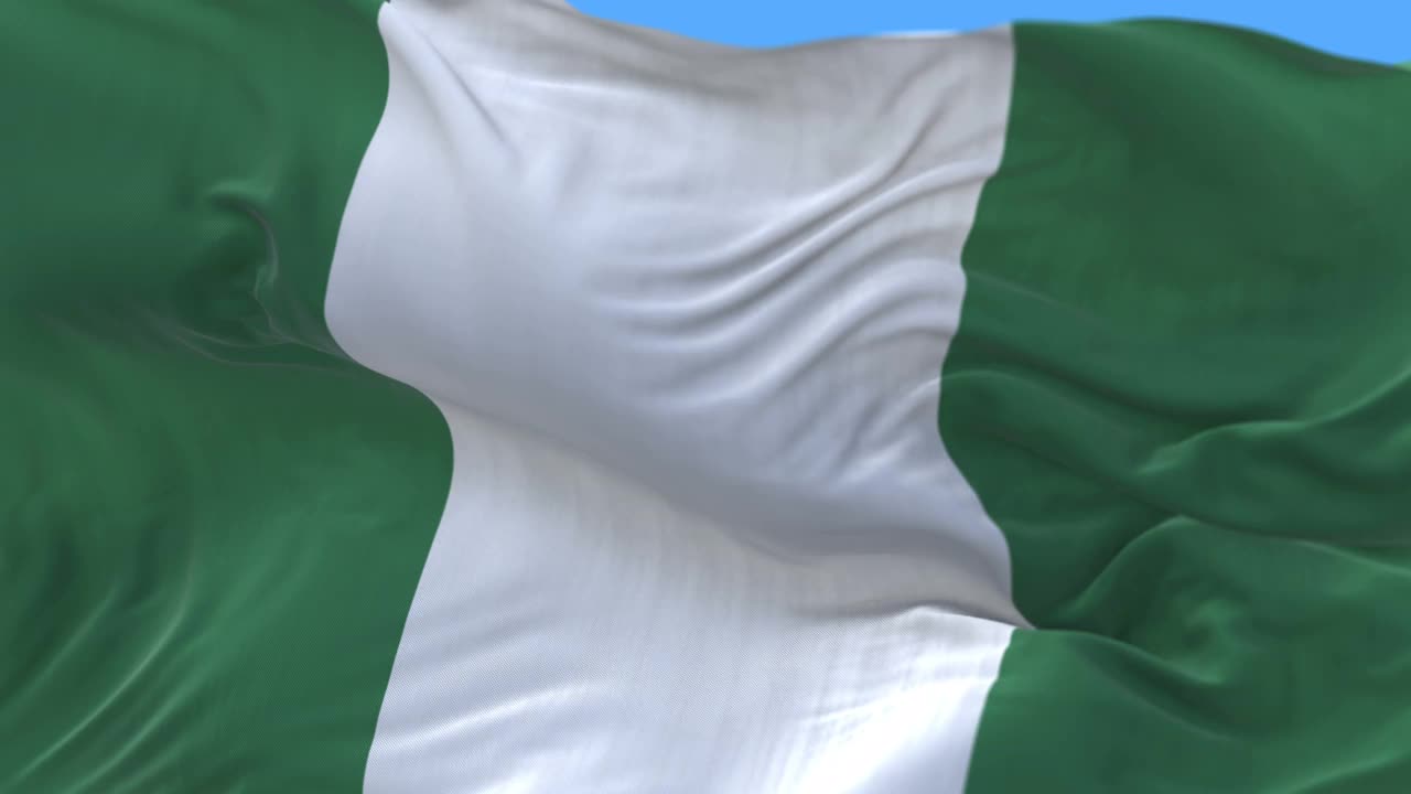 4k无缝特写尼日利亚国旗在风中缓缓飘扬。阿尔法通道包括视频下载